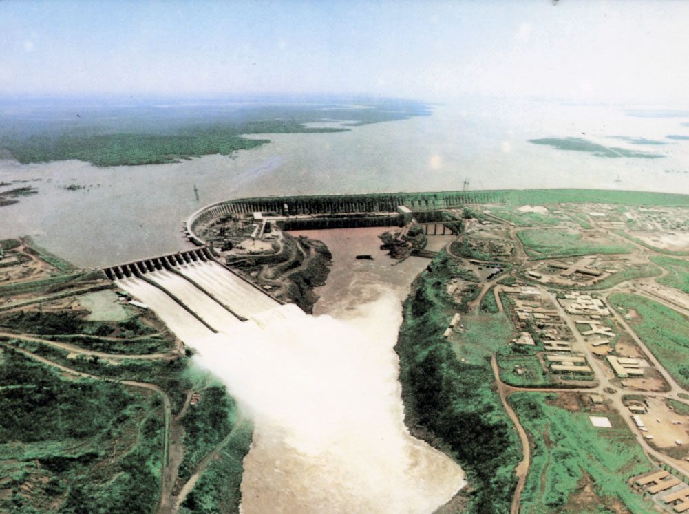 view of a hydroelectric power plant showing the spillway releasing water.